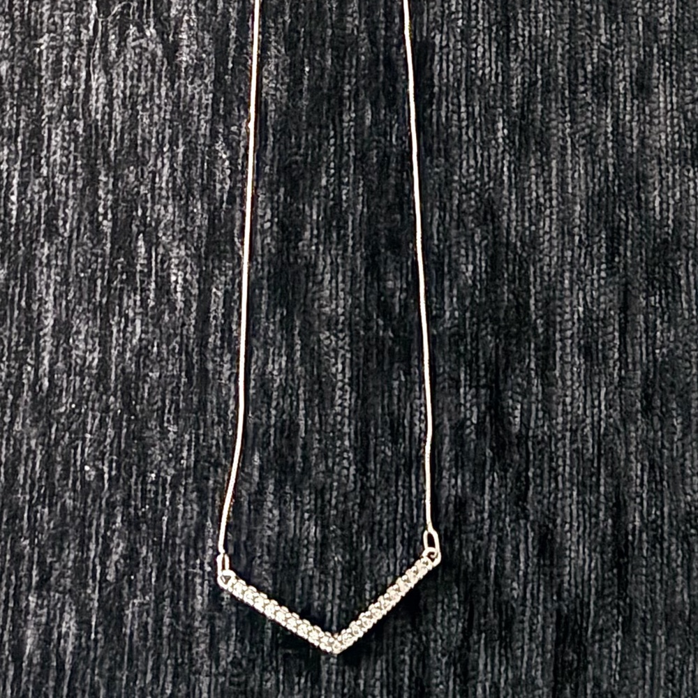 White gold chevron diamond necklace.